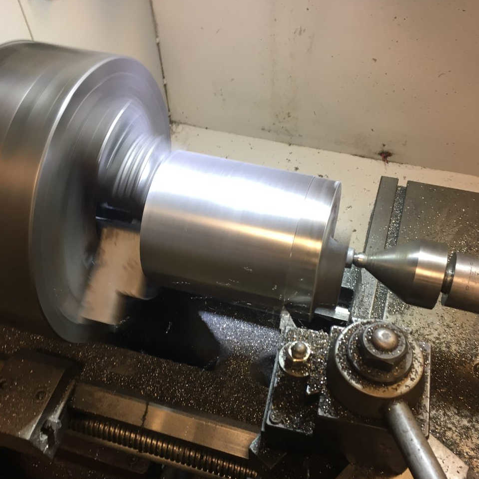 Rough machining of the piston's OD. It was a relief to see very little porosity or inclusions under the rough cast surface of the piston.